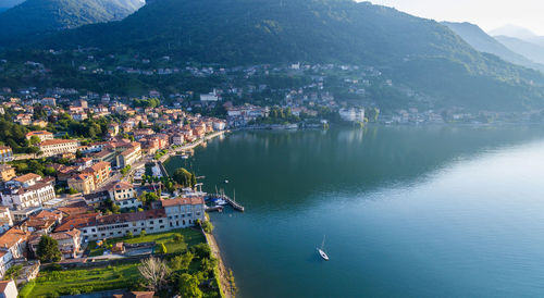 High angle view of townscape by river in city