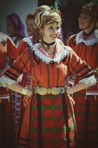 Woman in costume standing outdoors