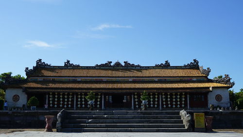 Low angle view of statues against sky