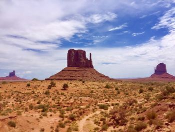 Rock formations on landscape against sky