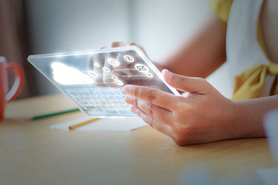 Close-up of hand holding mobile phone