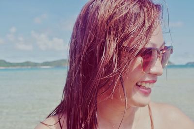 Close-up portrait of woman on beach