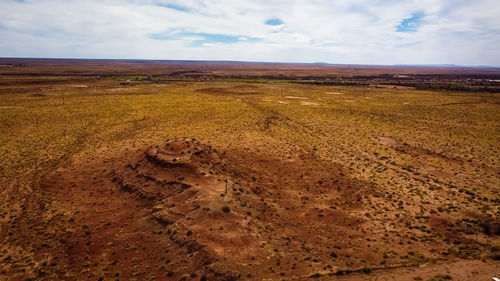 Scenic view of barren landscape against sky