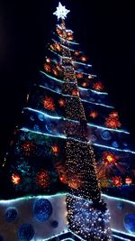 Illuminated christmas tree at night