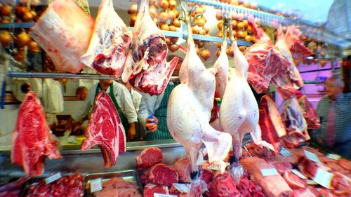 Meat hanging in butcher shop