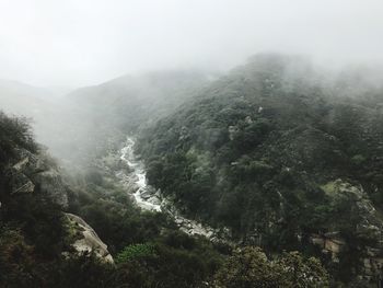 Scenic view of mountains in foggy weather