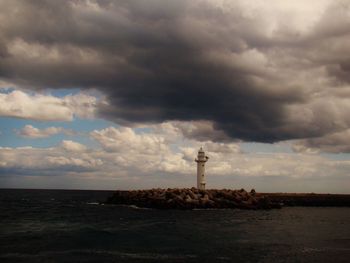 Scenic view of sea against cloudy sky