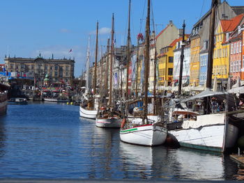 Boats moored at harbor