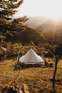 Tent on field against sky