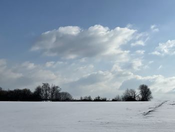 Scenic view of snow field against sky