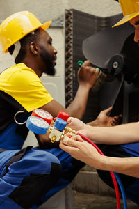 Side view of man working in workshop