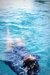 Woman swimming in pool