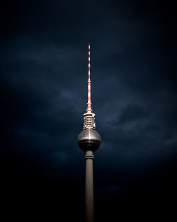 Low angle view of fernsehturm against sky at night