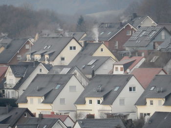 Houses in town against sky