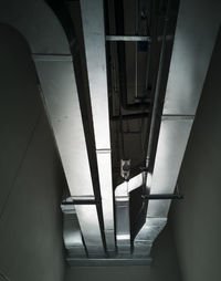 Low angle view of woman standing on staircase in building