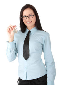 Portrait of smiling young woman against white background