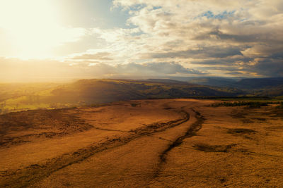 Scenic view of landscape against sky during sunset