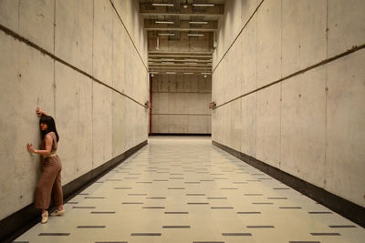 Woman on the wall in a subway station