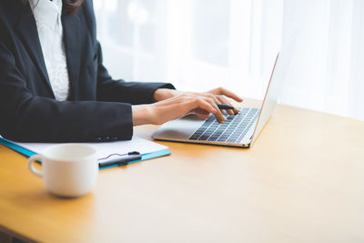 Man using laptop on table