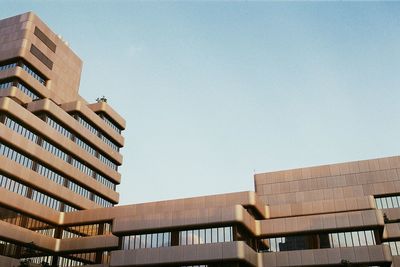 Low angle view of buildings against clear sky