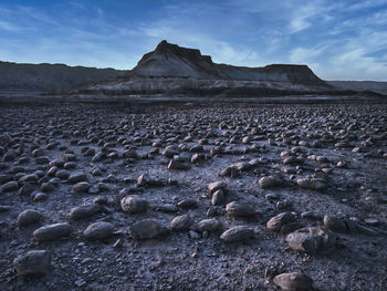 Scenic view of arid landscape against sky