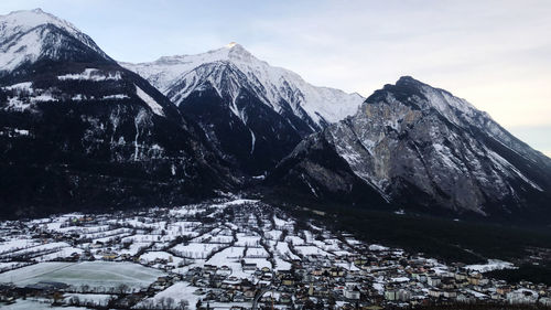 Scenic view of snowcapped mountains against sky