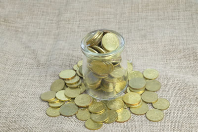 Close-up of coins in jar