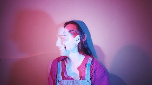 Multiple image of young woman against wall