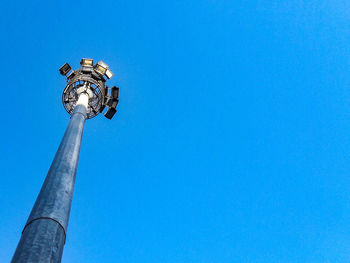 Low angle view of street light against clear blue sky