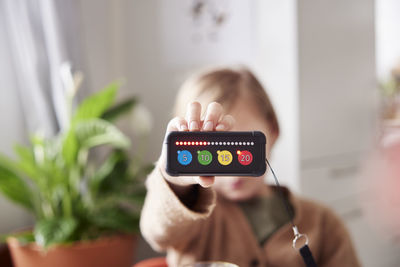 Child holding educational electronic game