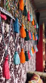 Close-up of multi colored decorations hanging in market