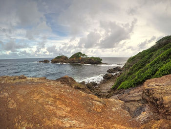 Scenic view of beach and sea against sky