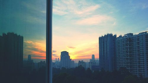 View of skyscrapers at sunset