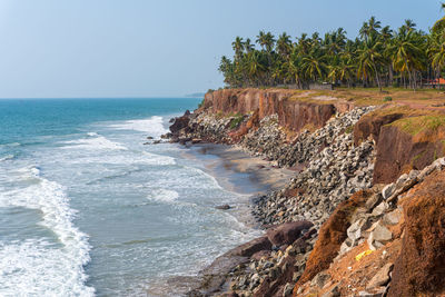 Coastline in varkala, kerala, india. shore protection measures, coastline strengthened with stones