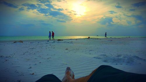 Scenic view of beach against sky during sunset