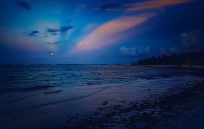 Scenic view of sea against sky at sunset