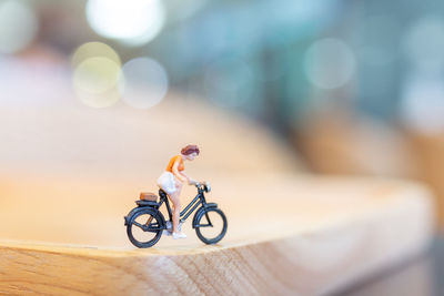 Close-up of toy bicycle on table