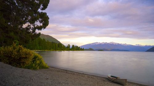 Scenic view of lake against sky during sunset