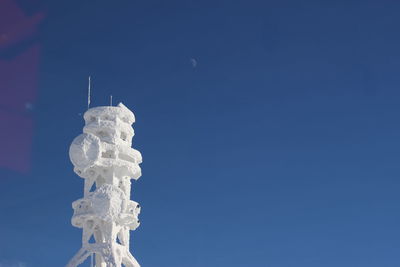 Low angle view of statue against clear blue sky