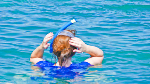 Woman swimming in pool