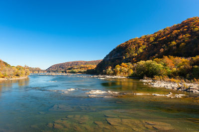 The crystal clear water of the potomac river in harpers ferry, west virginia on a sunny day in fall