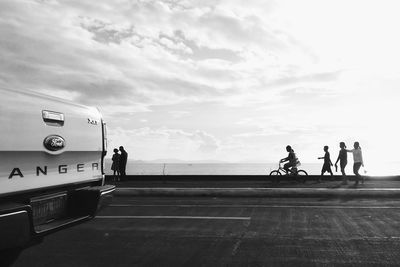 People on road along buildings