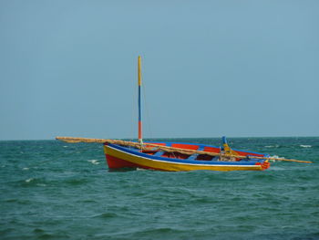 Scenic view of calm sea against clear sky