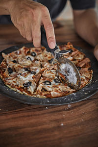 Midsection of man preparing food on table