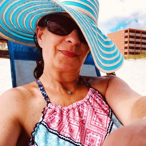 Portrait of smiling woman wearing sunglasses