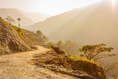 Scenic view of mountains against sky during foggy weather