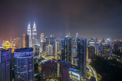 Aerial view of city lit up at night