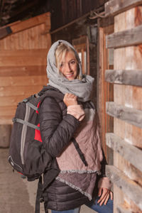 Portrait of woman standing at entrance