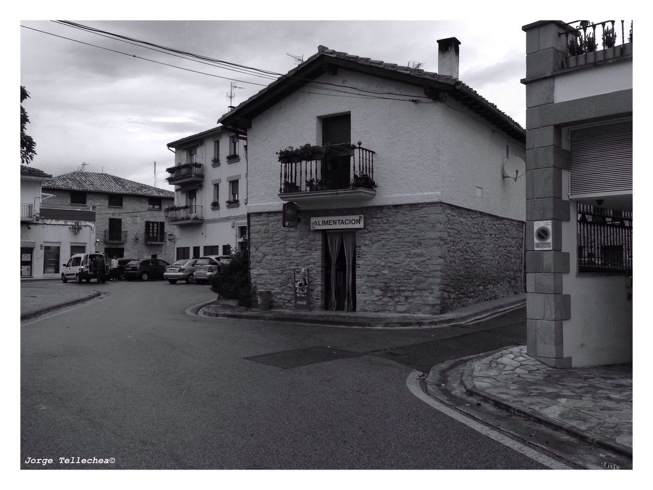 architecture, building exterior, built structure, transfer print, city, auto post production filter, street, sky, residential structure, transportation, residential building, building, road, the way forward, day, outdoors, cobblestone, incidental people, diminishing perspective, house