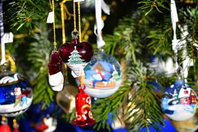 Close-up of christmas decorations hanging on tree